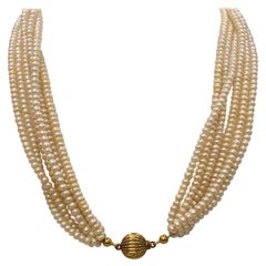 Vintage Six-Strand Fresh Water Button Pearl Choker Necklace with gold clasp.