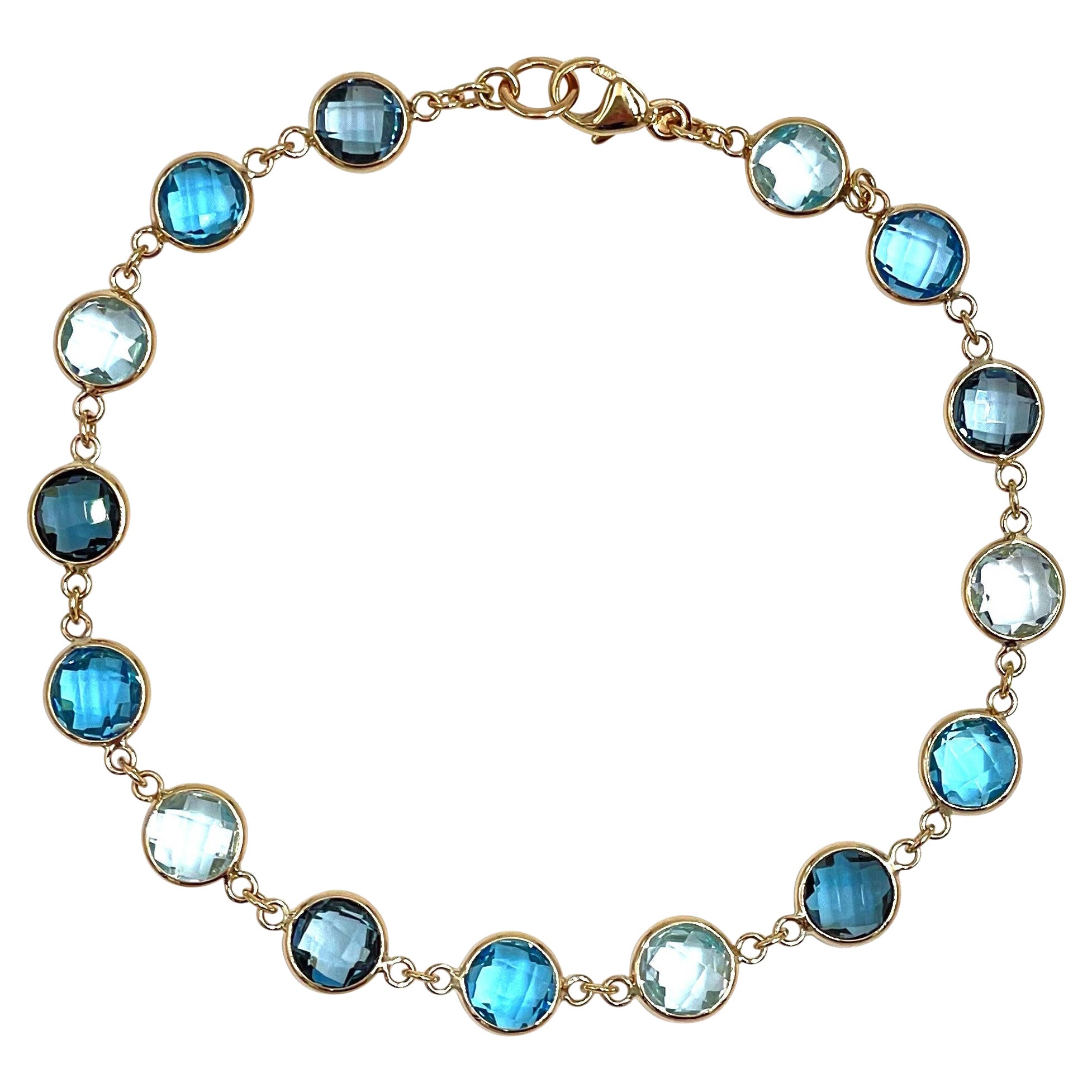 14K Yellow Gold Multi Hue Round Blue Topaz Riviera Bracelet with Extender For Sale