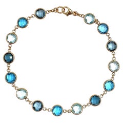 14K Yellow Gold Multi Hue Round Blue Topaz Riviera Bracelet with Extender