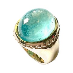 750/Anillo Oro Rosa 21gr. con 1 Aguamarina Cabouchon 16.02cts.