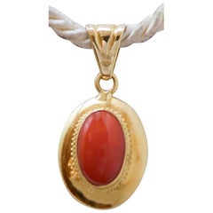 Coral, 18 Karat Yellow Gold Pendant.