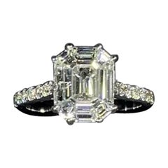 1.74ct Emerald diamond pave band engagement ring in 18k white gold.