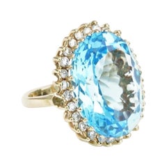Anello di diamanti con topazio blu svizzero da 25 carati in oro giallo 14k Cocktail Ovale
