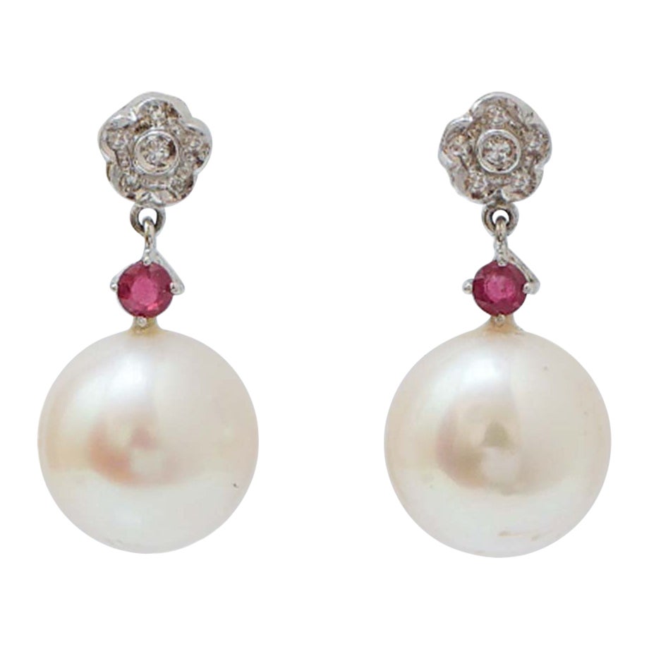 Pendientes de perlas, rubíes, diamantes y platino