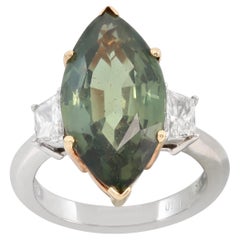 Platin- und Gelbgoldring mit GIA-zertifiziertem Marquise-Saphir und Diamant