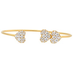 Bracciale aperto con cuore in oro giallo e diamanti Pave