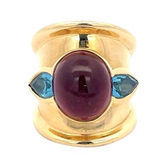 Bague en or jaune 18 carats avec rubellite et topaze bleue
