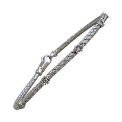 Bracciale vintage in stile stazione con diamanti incastonati, oro bianco 14k