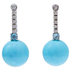 Topacio color aguamarina, diamantes, pendientes de tenis de oro blanco de 14 kt.