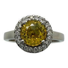 Anillo Halo de Platino con Zafiro Natural y Diamantes de Corte Redondo Amarillo Vivo de 1,36ct
