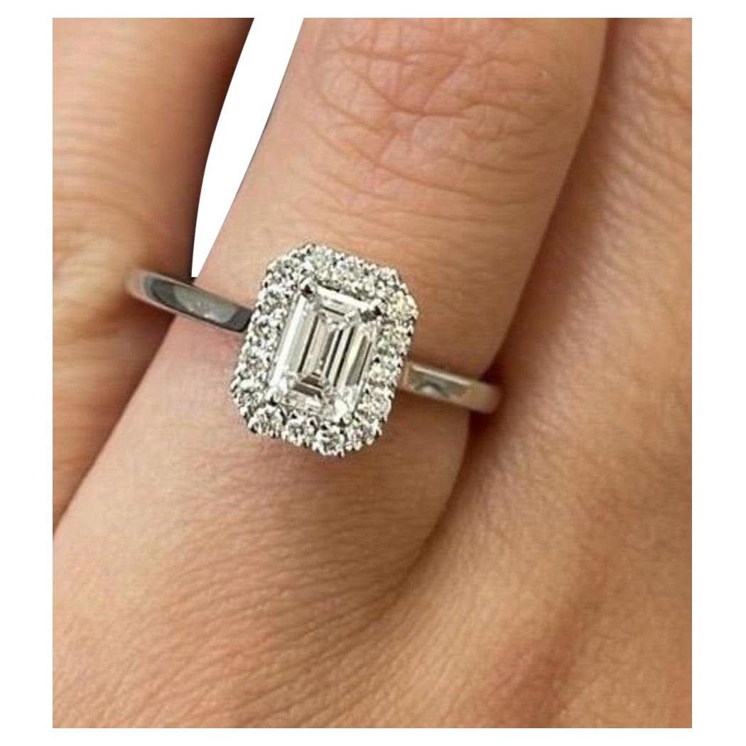 The Elegant Halo Emerld cut diamond ring
