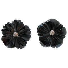 Blumenohrringe aus Onyx, Diamanten, Roségold und Silber.