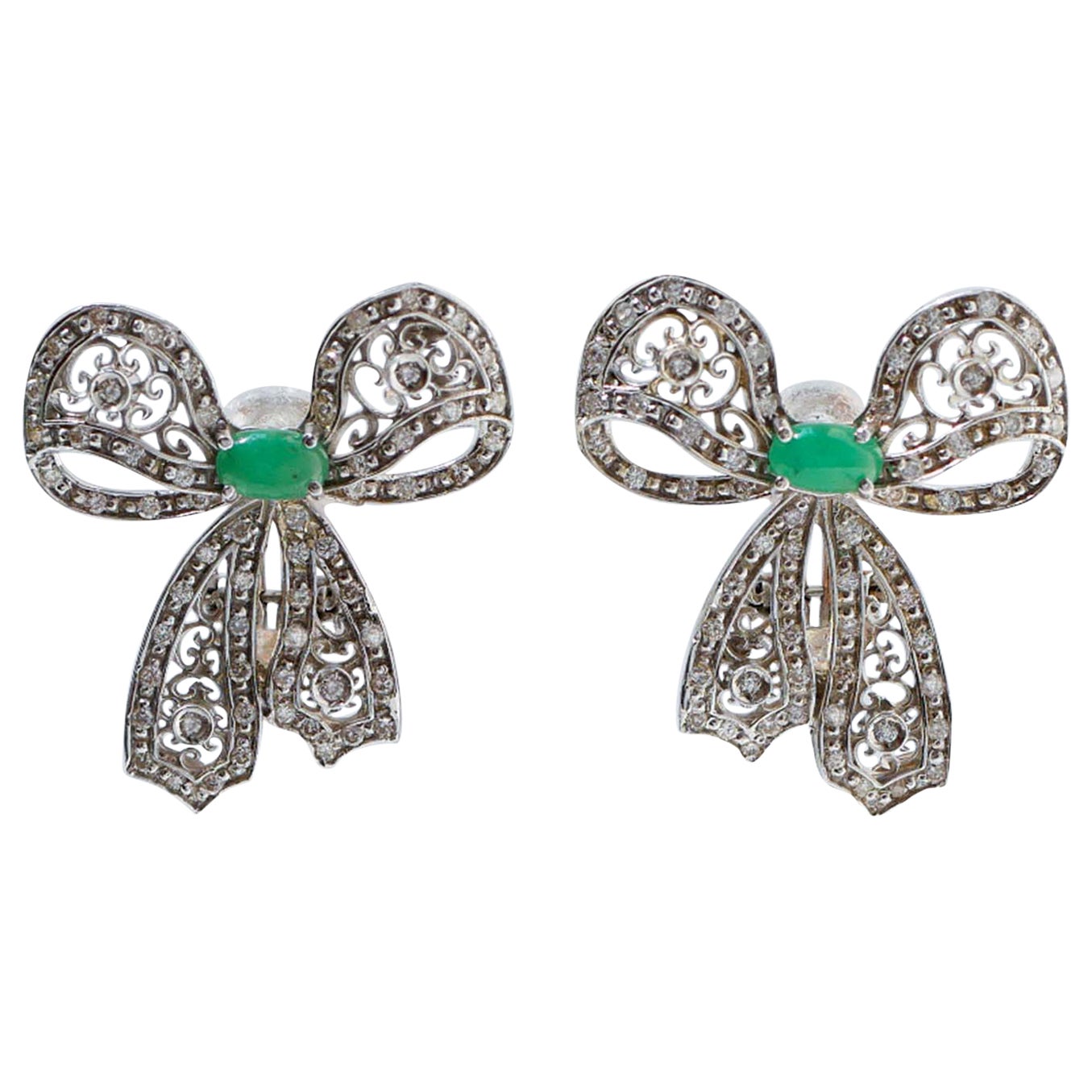 Emeralds, Diamonds, White Gold Bow Earrings.