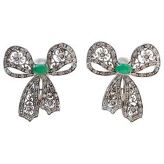 Emeralds, Diamonds, White Gold Bow Earrings.