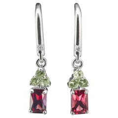 Orecchini con granato e zaffiro verde in oro 14k