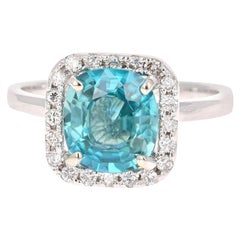 Anello con diamante e zircone blu in oro bianco 14 carati