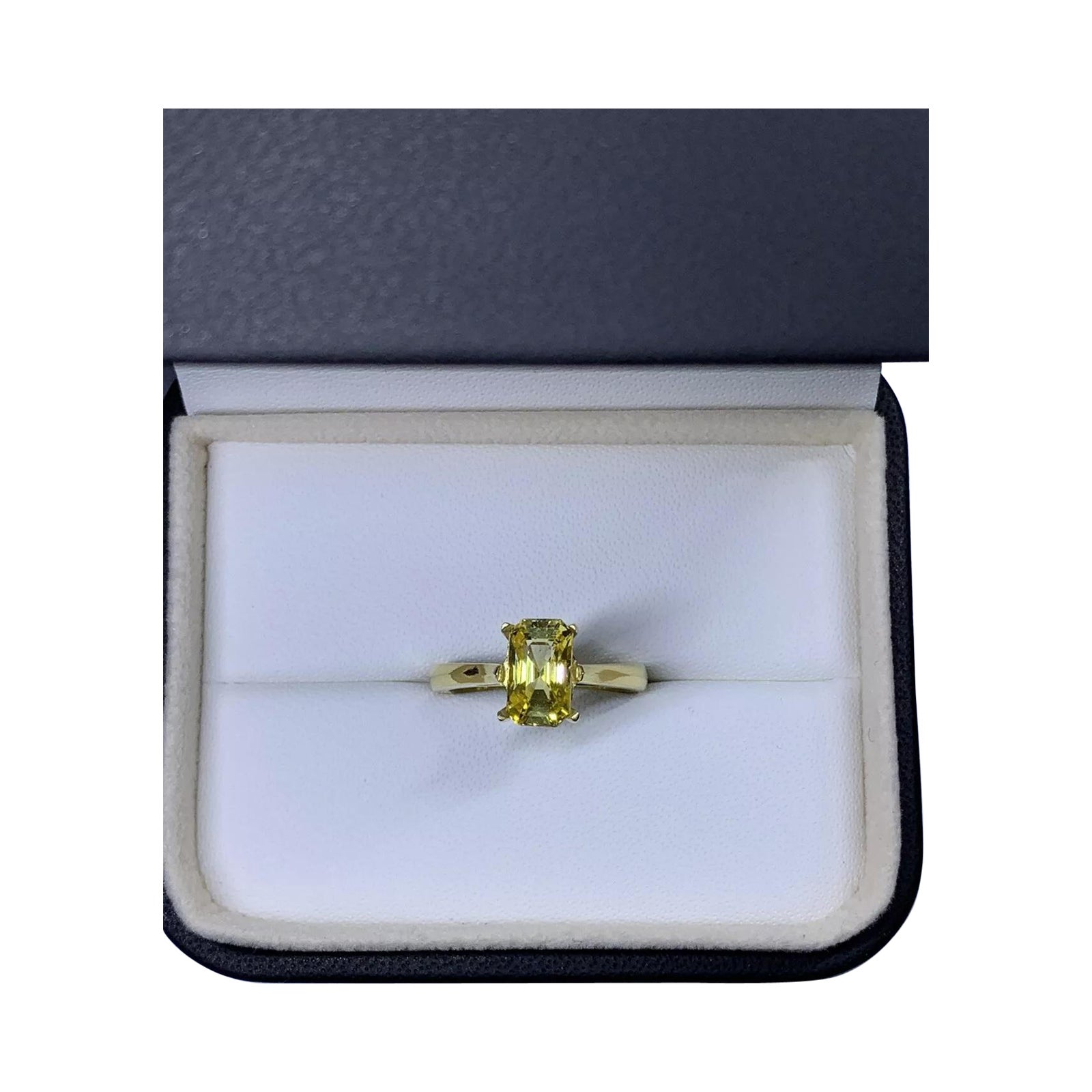 Yellow sapphire emerald engagement ring in 18k yellow gold.