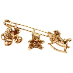 Vintage Cartier Three Baby Related Charms Yellow Gold Safety Pin Brooch