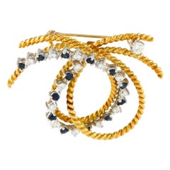 18K Yellow Gold 0.80ct Diamond and Sapphire Knot Brooch