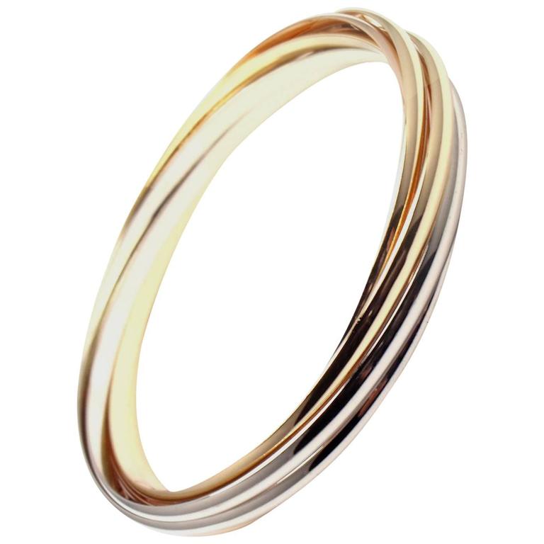 Cartier Trinity Rolling 7 Bangles Tri Color Gold Bracelet At 1stdibs Cartier Trinity Rolling 7 Bangles Tri Color Gold Bracelet For