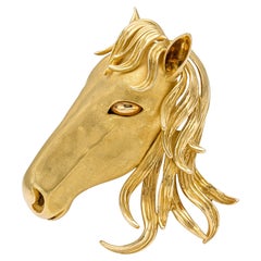 Broche cheval vintage en or des années 1970