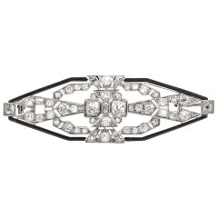 Broche ancienne Art déco des années 1930, diamant 7,50 carats et onyx