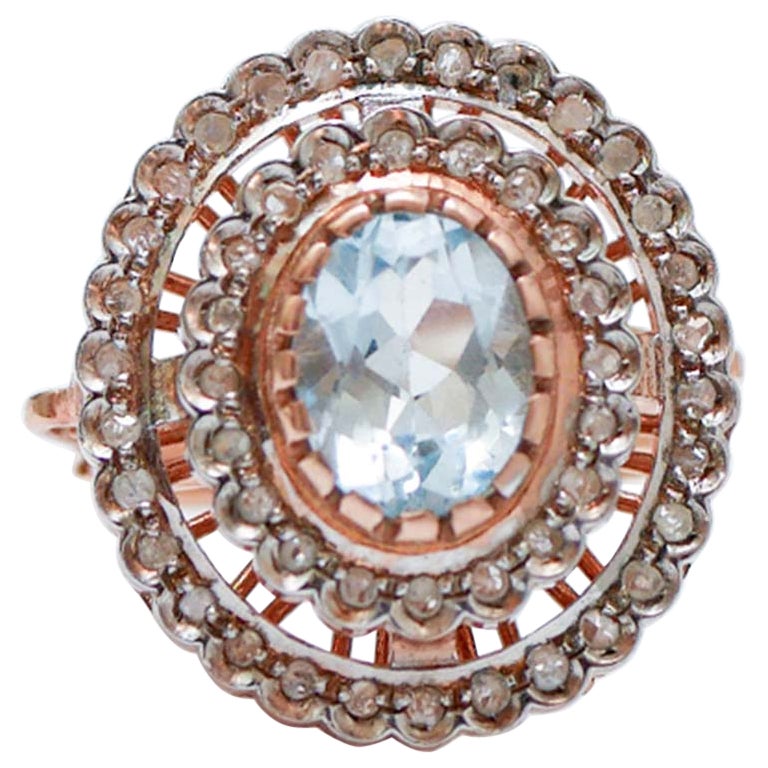 Aquamarine Colour Topaz, Diamonds, Rose Gold and Silver Ring.