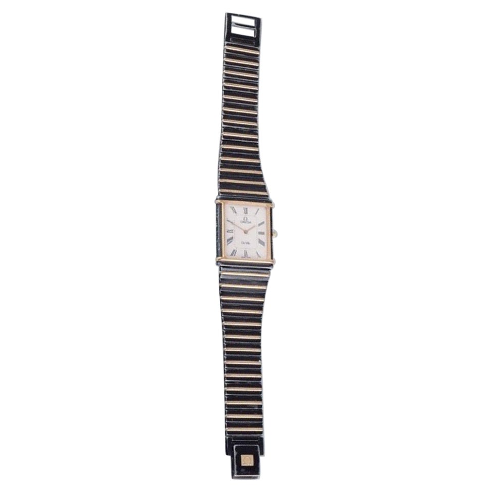 Omega De Ville men's wristwatch in brass and black metal. 1980s.