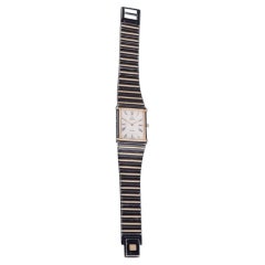Omega De Ville men's wristwatch in brass and black metal. 1980s.