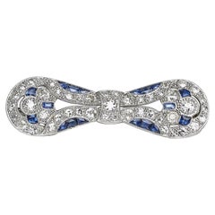 Art Deco Sapphire, Diamond And Platinum Bow Brooch, Circa 1930