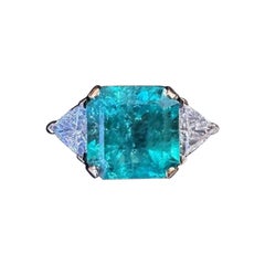 GIA Colombian 7.72 carat Emerald in Three Stone Ring in 18k Yellow Gold