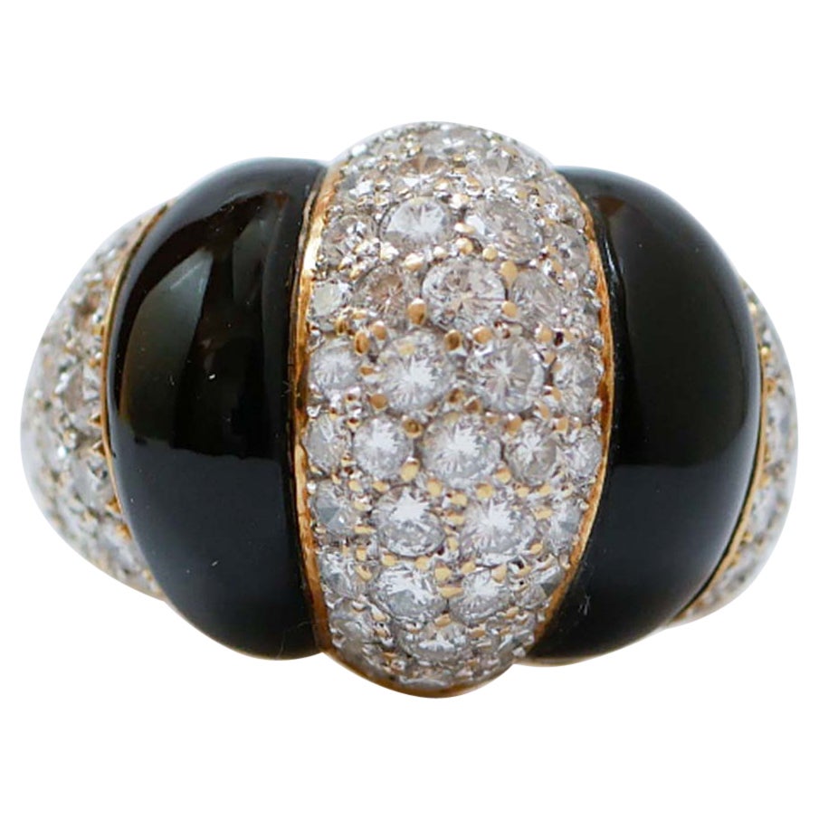 Diamonds, Onyx, 18 Karat Yellow Gold Ring.