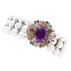 Amethysts, Pearls, Diamonds, Iolite, Topaz, Tsavorite, Gold and Silver Bracelet.