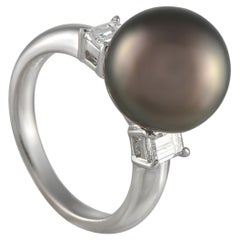 Bague en platine, diamant 0,40 carat et perle