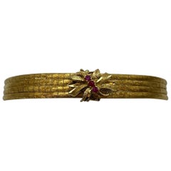 Bracciale vintage multifilo in oro giallo 18 kt. con rubini