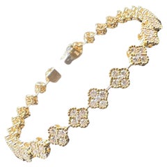 Bracciale tennis stile trifoglio con diamanti in oro giallo 18k