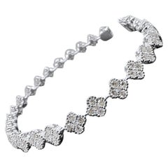 Bracciale tennis stile trifoglio con diamanti in oro bianco 18 carati