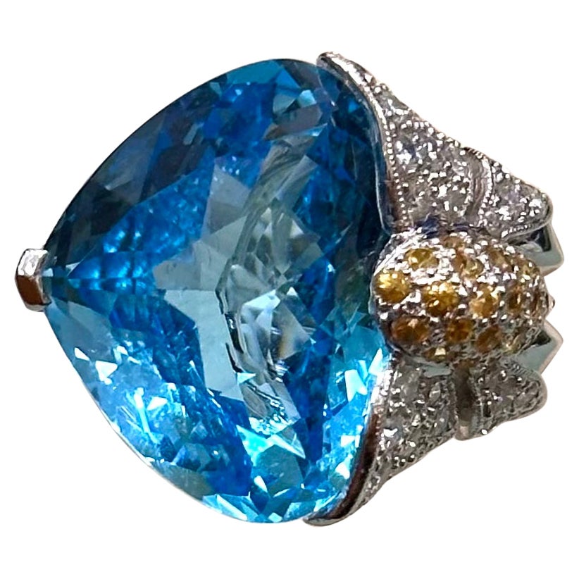 Floral Blue Topaz Ring with Diamonds and Yellow Sapphires set in 18k White Gold For Sale
