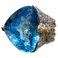 Floral Blue Topaz Ring with Diamonds and Yellow Sapphires set in 18k White Gold