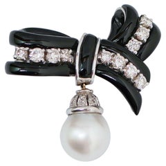 South-Sea Pearl, Onyx, Diamonds, 14 Karat White Gold Ribbon Brooch.