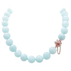 Aigue-marine, rubis, diamants, collier en or rose et argent.