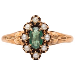 Antique 1910s Art Deco Emerald Seed Pearl 9 Karat Yellow Gold Halo Ring