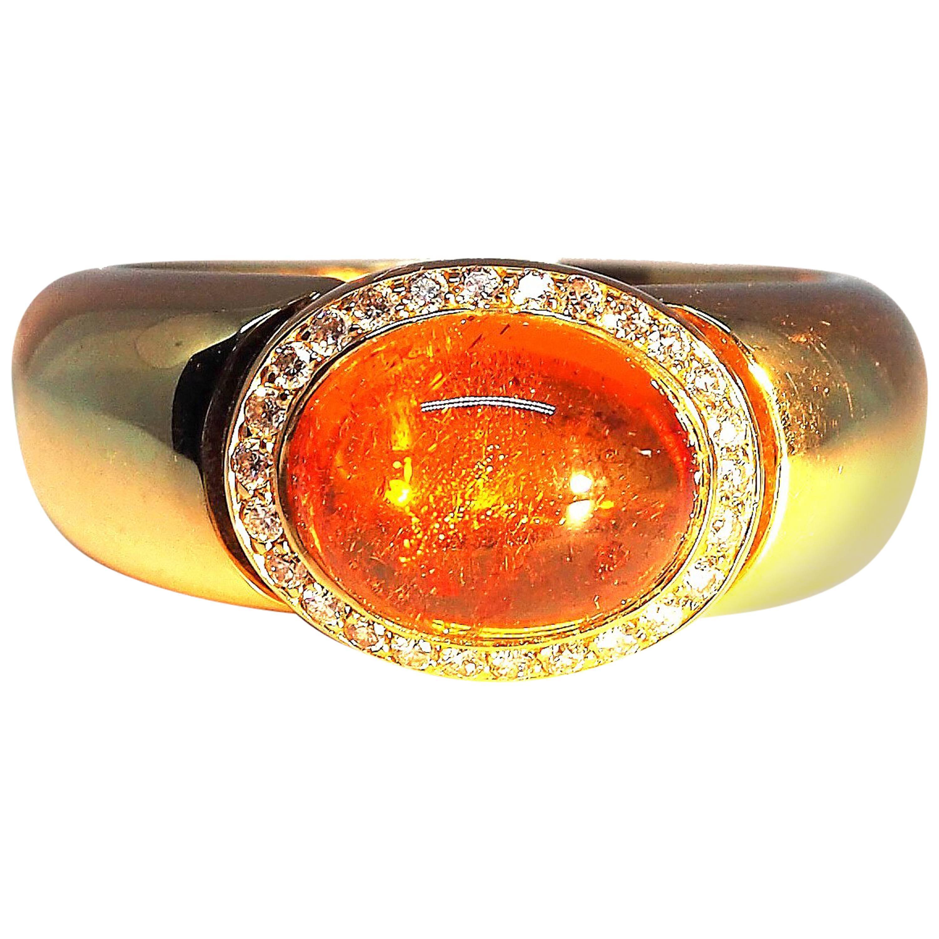 Thomas Leyser is renowned for his contemporary jewellery designs utilizing fine coloured gemstones and diamonds. 

This ring in 18k rose gold is set with a top quality Mandarine Garnet Cabouchon in an oval cut, 10x8mm - 4.21cts. and 26 diamonds