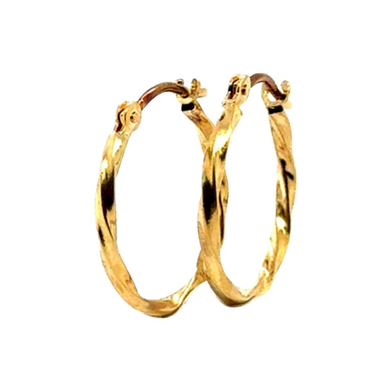 Boucles d'oreilles torsadées en or jaune 18K en vente
