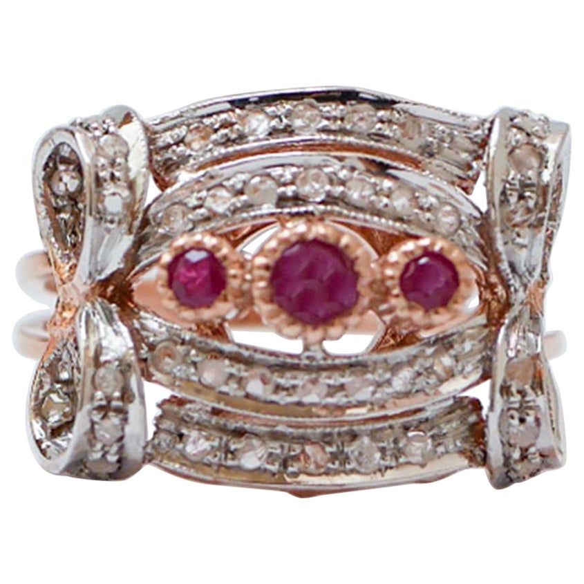 Anello con rubini, diamanti, oro rosa e argento.