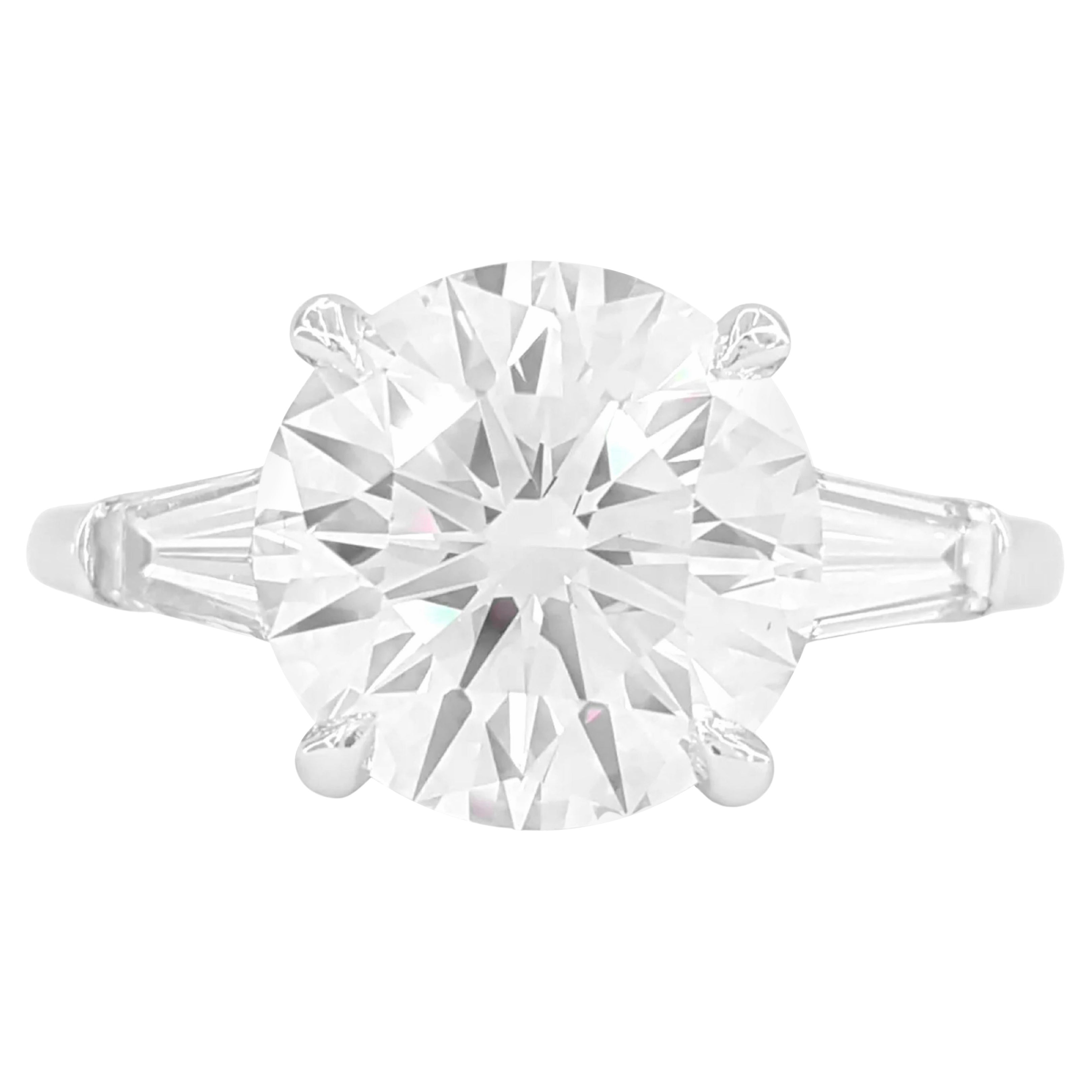 GIA Certified 4 Carat Round Brilliant Cut Diamond Ring with tapered baguette