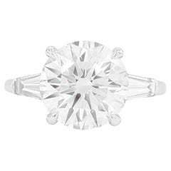 GIA Certified 4 Carat Round Brilliant Cut Diamond Ring with tapered baguette