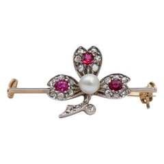 Pearl, Rubies, Diamonds, 12 Karat Rose Gold and Silver Brooch.