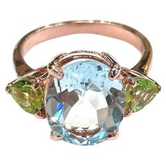 Bague Bochic Orient en or et argent 18 carats, péridot vert et topaze bleue ovale