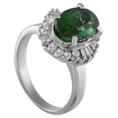 Anello in platino con diamante e tormalina da 0.33 carati